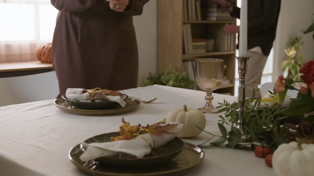 Festive Thanksgiving Table Setting with Pumpkins and Fall Decor