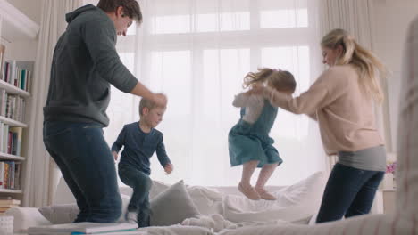 happy family dancing at home having fun dance celebrating together little children celebrate with mother and father enjoying exciting weekend 4k footage