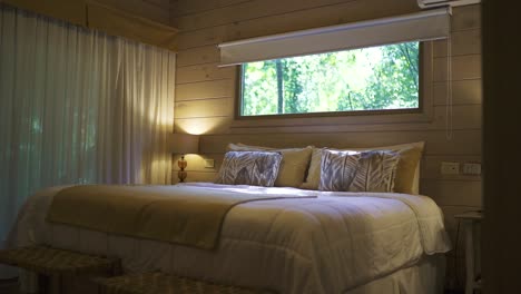 cozy cabin bedroom with jungle view