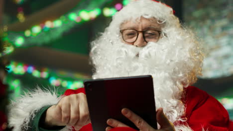 santa claus using a tablet