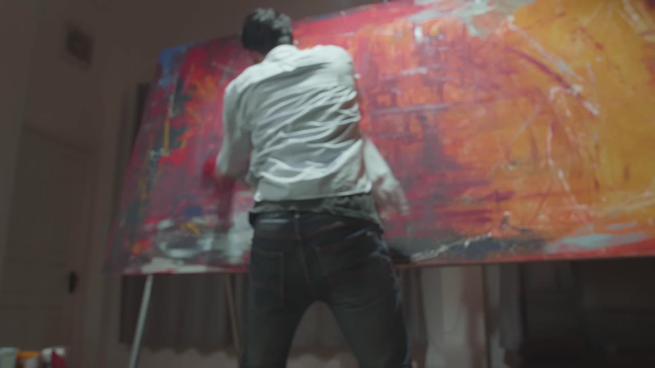 Male Artist Draws With His Hands On The Large Canvas, Using Fingers He Creates Colorful, Emotional, Sensual Painting