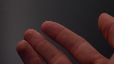 a human fingerprint glowing during scanning to protect a unique identity for a private access encryption key