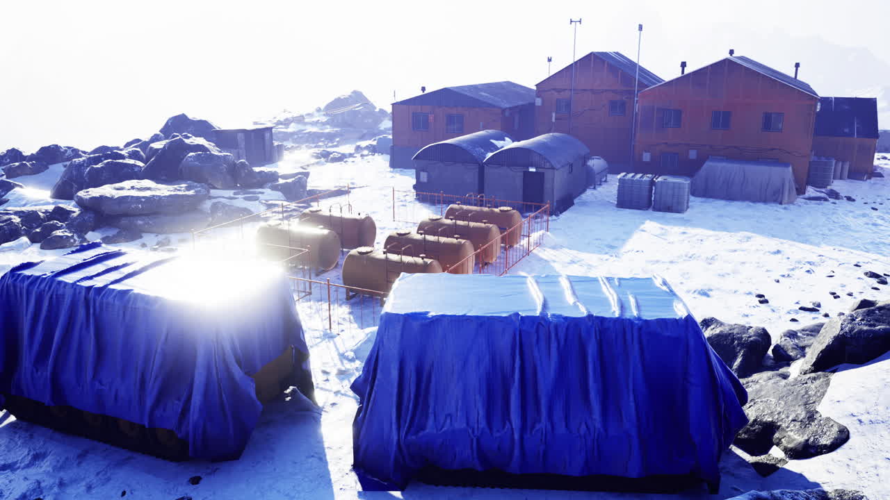 Explorers set up temporary shelter in a snowy landscape at dawn