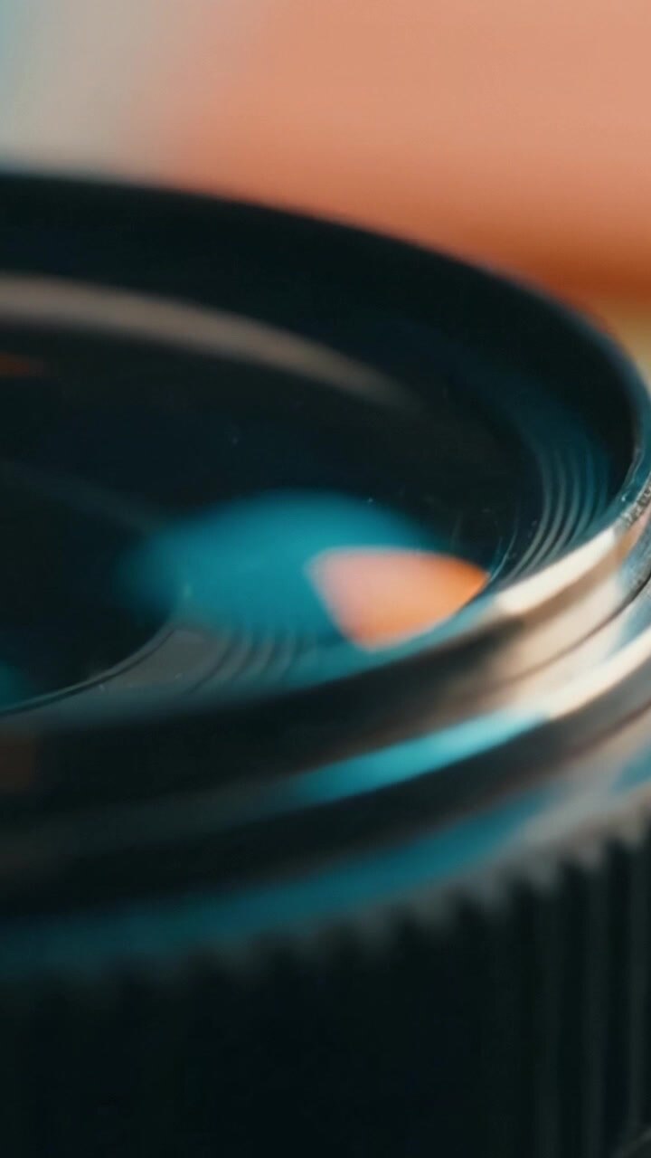 Close-Up View of a Camera Lens Highlighting the Intricate Details and Reflections Within the Glass Elements for Photography Enthusiasts and Technicians