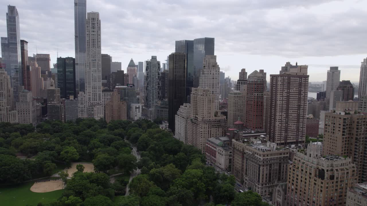 Aerial view over the Central park, towards buildings and the western street in NYC, USA