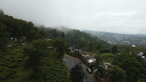 Scenic-Mountain-Road-On-A-Misty-Day-In-Jakarta,-Indonesia---aerial-drone-shot