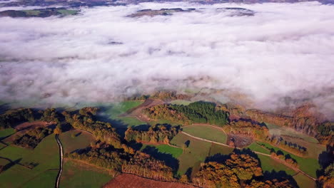 breathtaking aerial shot high above the clouds above the camino de santiago trail in spain