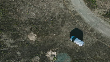 vehicle arriving and parking on vacant space with gravel