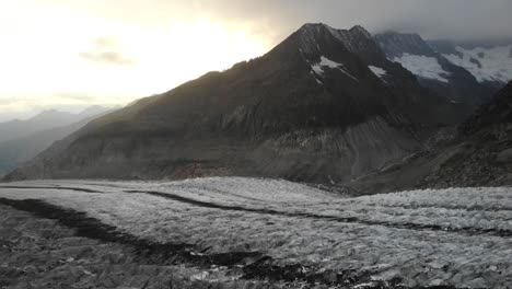 aerial flyover over the longest glacier in the alps - the aletsch glacier in valais, switzerland - with rotating full view of the glacier