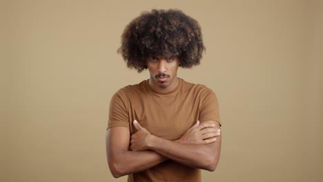 serious man with an afro and mustache