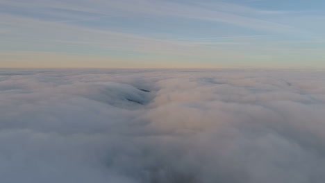 over a clouds and sunset colors, in the balkan mountains, on a sunny, winter, dawn, in central balkan national park, bulgaria