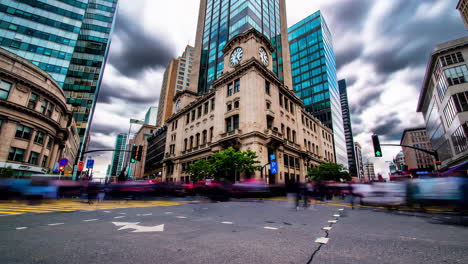 busy city intersection with skyscrapers and old building