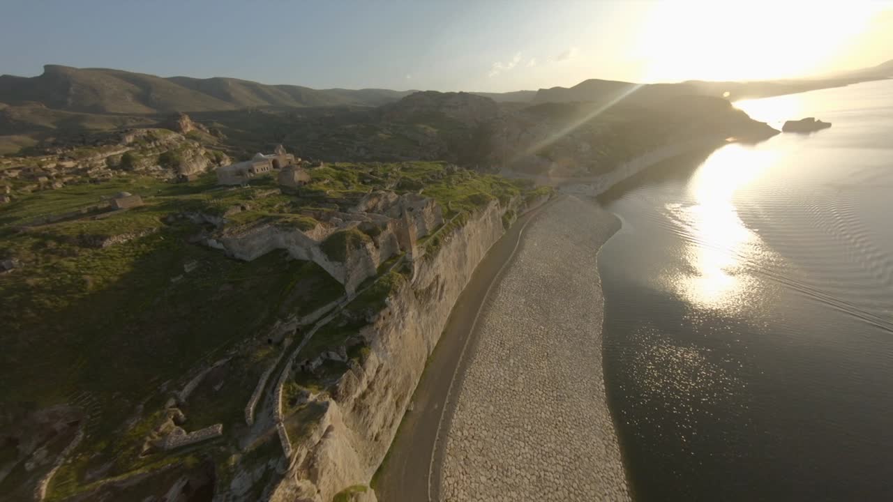 Epic Fast Dynamic FPV drone footage at Sunset time in Old Cave CIty of Hasan Keyf. HasanKeyf is one of most Famous ancient and historical city in middle east near big river Tigres.