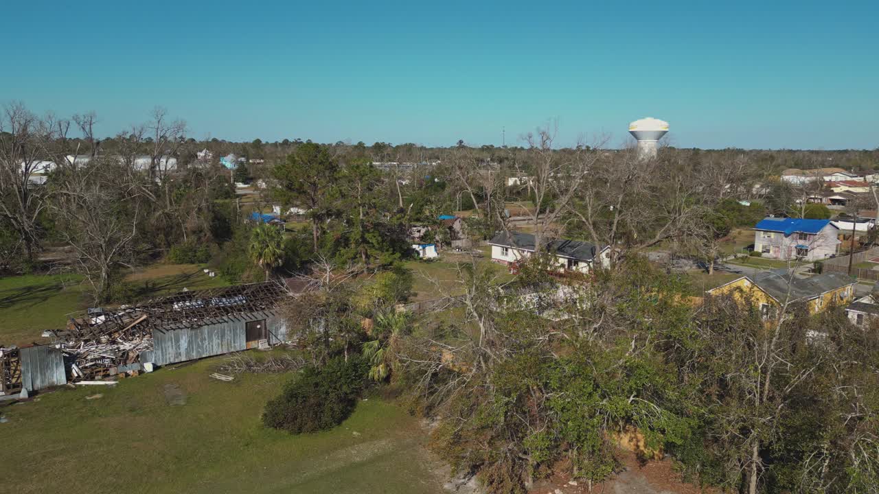House Roof Destroyed By Catastrophic Hurricane In Valdosta, Georgia, USA. aerial panning shot