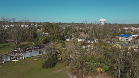 house roof destroyed by catastrophic hurricane in valdosta, georgia, usa. aerial panning shot