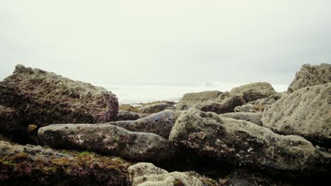rocks amongst the waves in a unusual beach