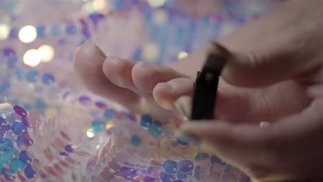 woman's foot care: clipping toenail with nail clippers, close-up detail