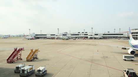 time-lapse of airport activity with planes and vehicles