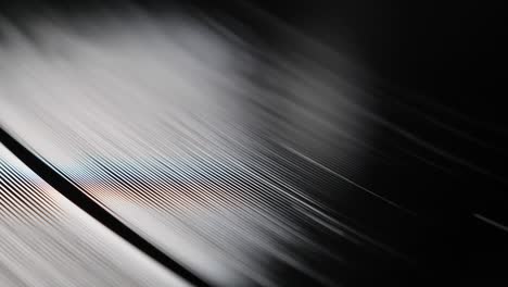 close up, macro shot of old vinyl disc spinning on a record player