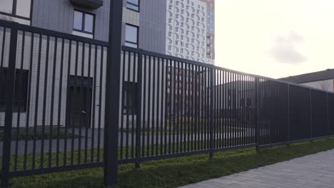 modern apartment building with fence