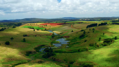 clouds shadow over green valley and river during summer in atherton tablelands, queensland australia