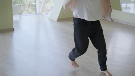 man breakdancing in modern studio