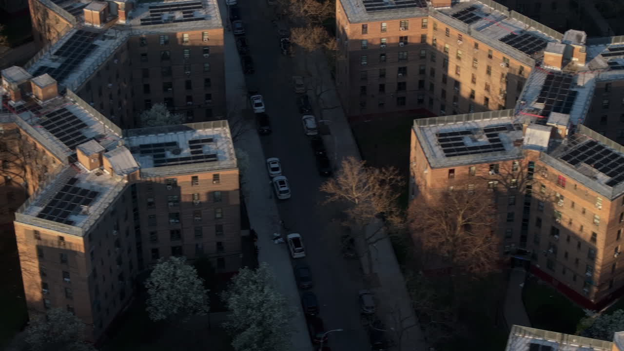Aerial view of solar panels on public housing project buildings. Shot at sunrise in Queensbridge, Queens, New York City.