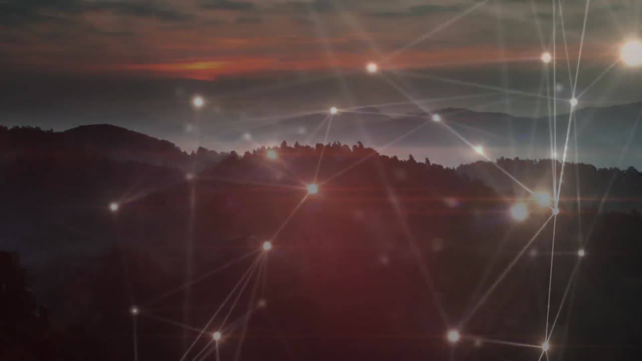 Animation of glowing network of connections moving over sunset landscape