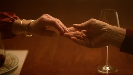 Senior-love-couple-hands-holding-at-home-closeup.-Old-people-arms-separating