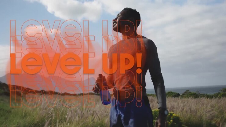 Animation of the words level up in orange over happy man exercising in countryside taking a rest