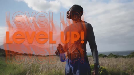 animation of the words level up in orange over happy man exercising in countryside taking a rest