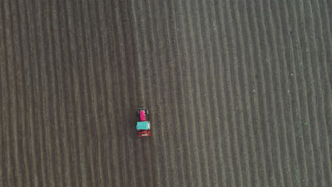 aerial view of a tractor plowing a field