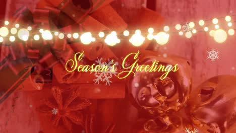 Animation-of-season's-greetings-text-with-fairy-lights-over-spices-and-decorations-on-red-background