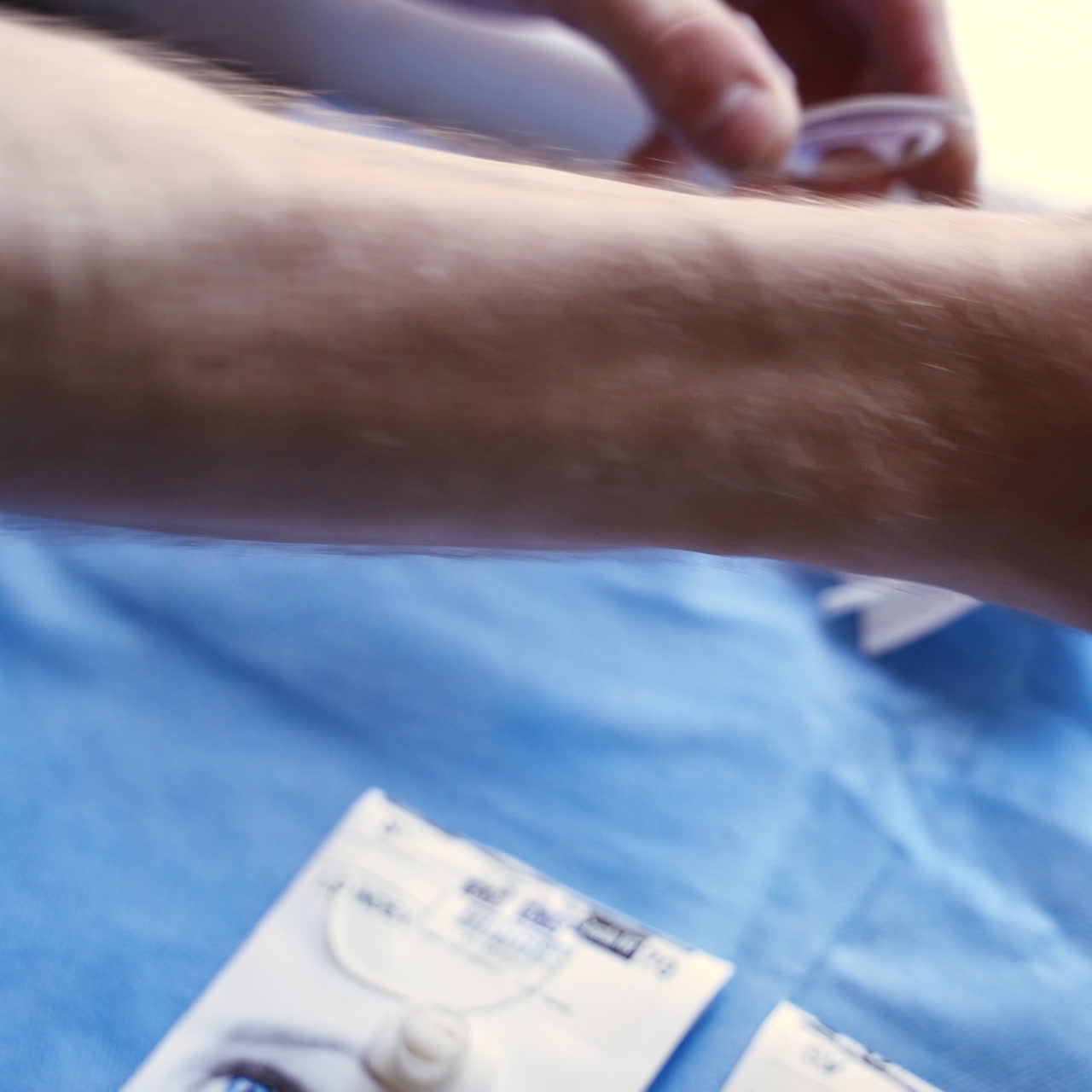 Technician making spectacles. Man's hands producing lens for eyeglasses in the laboratory. Vision concept.