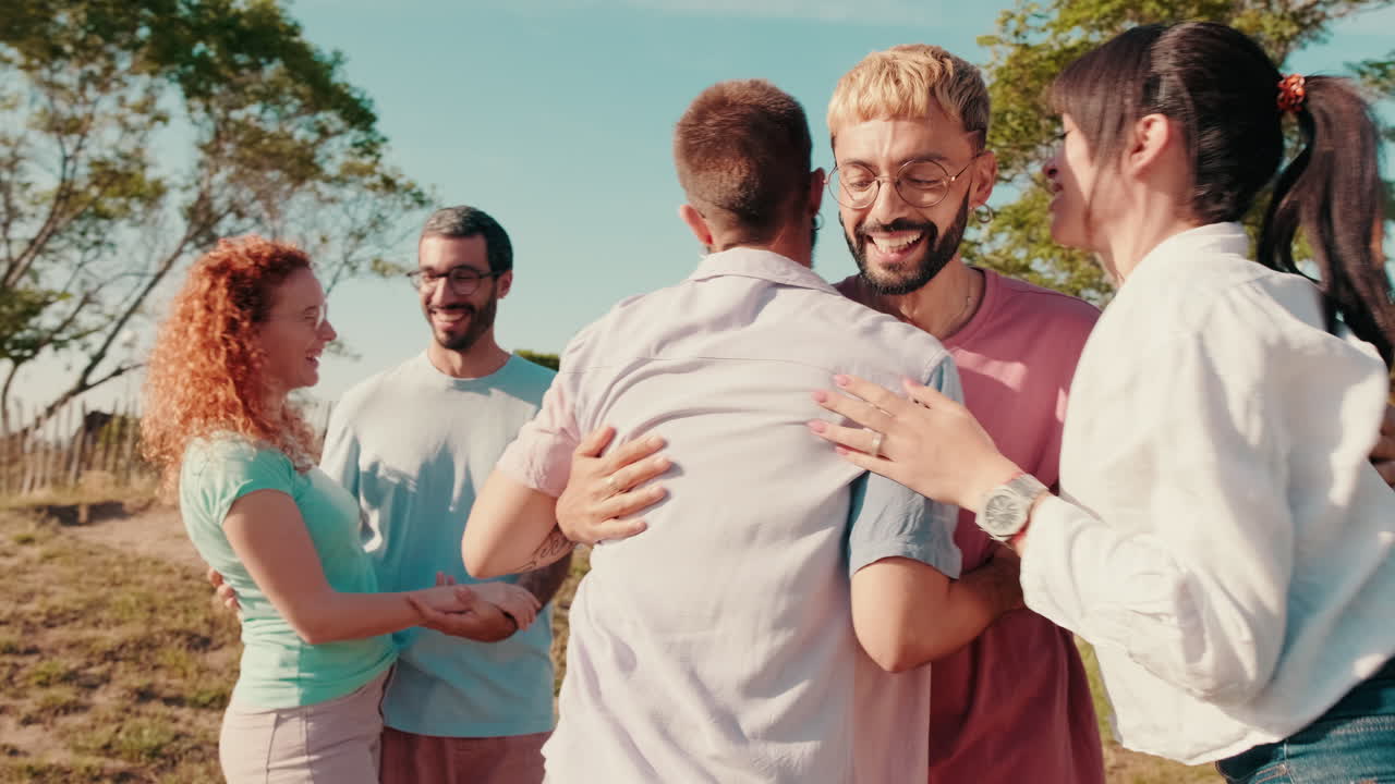 Friends Hugging and Enjoying a Sunny Picnic