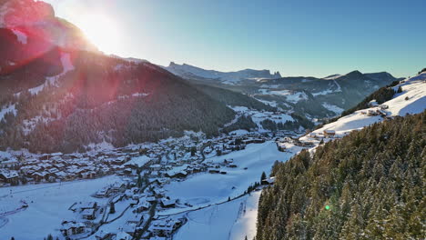 sunshine over snowy mountain town