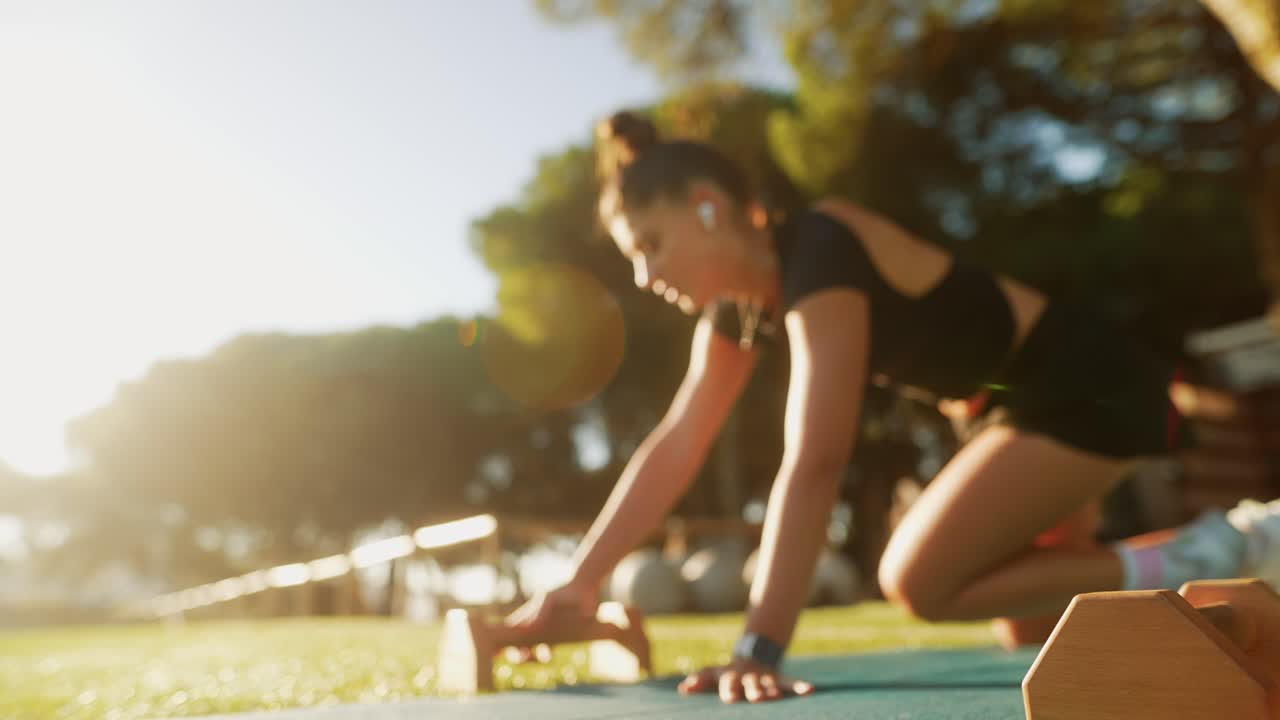 Woman Doing Push-Ups in the Park