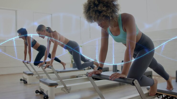 Women exercising on reformer machines with DNA strand animation overlay