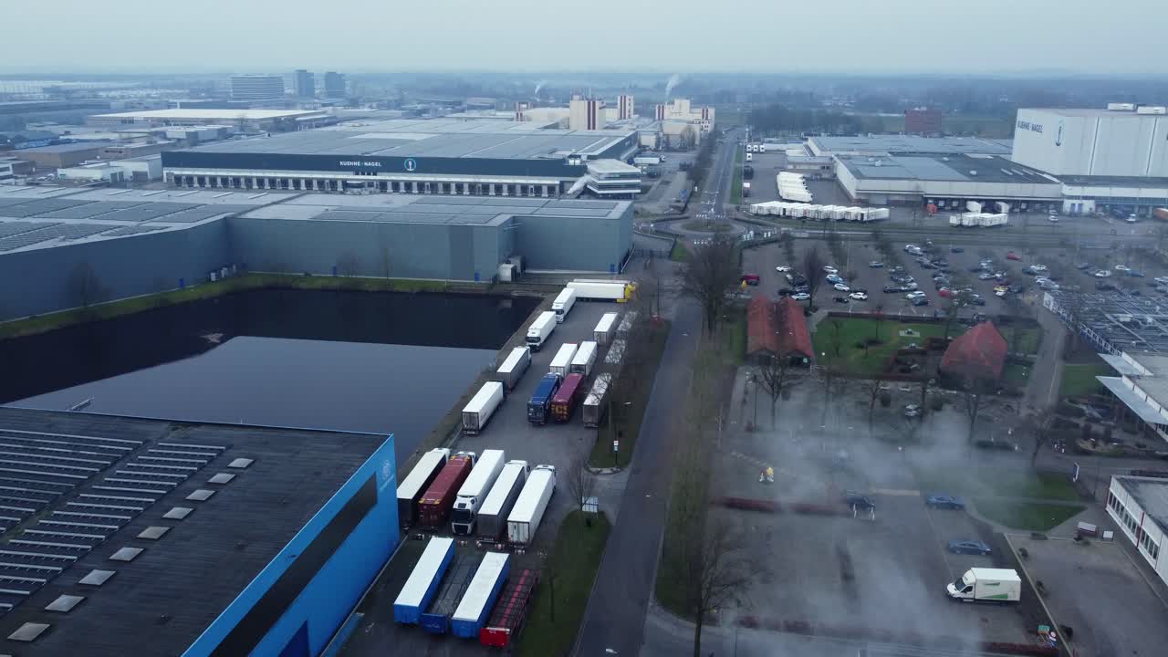 Aerial view of industrial area with trucks and warehouses