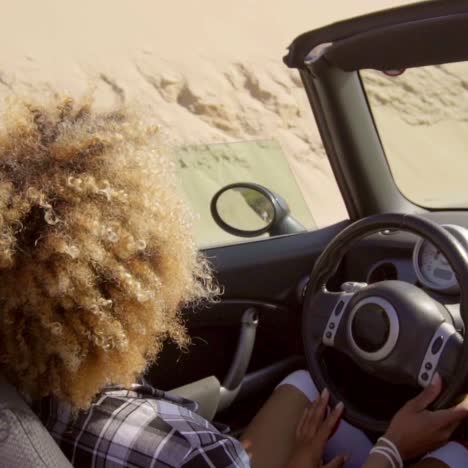 young woman driving her cabriolet