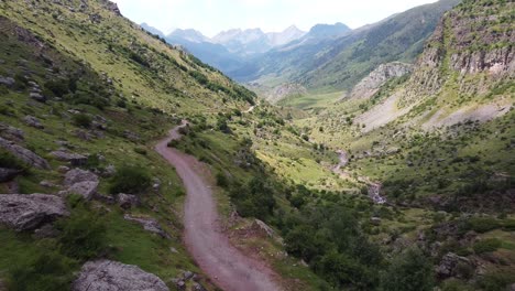 spanish pyrenees, spain - aerial drone view of the hiking trail and green valley of valle de aguas tuertas