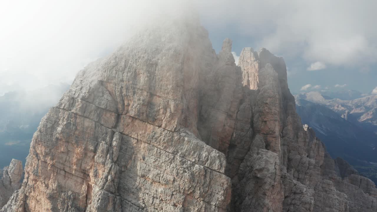 Aerial view of Croda da Lago mountain peaks with clouds covering