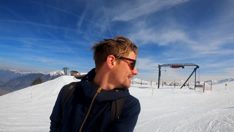 happy man enjoying the snowy environment on skis