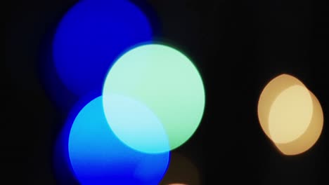 video of flickering multi coloured bokeh spots of light with copy space