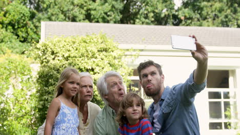 multi-generational family taking a funny picture