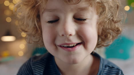 portrait happy little boy making faces smiling naughty child enjoying childhood having fun at home