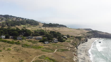 wide aerial push in over the coasts of sea ranch, california