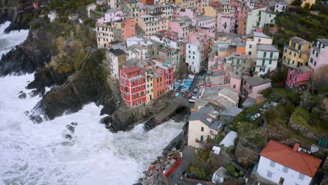 Aerial-view-of-Riomaggiore,-Cinque-Terre,-during-a-sea-storm