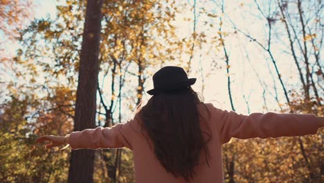 woman enjoying the autumn forest