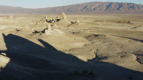 Wide-Retreating-Aerial-shot-of-the-Pinnacles-at-sunrise-in-the-california-desert